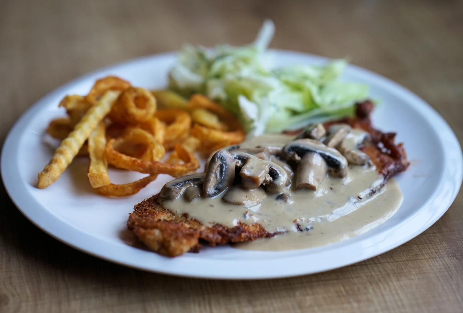 A schnitzel on a plate.