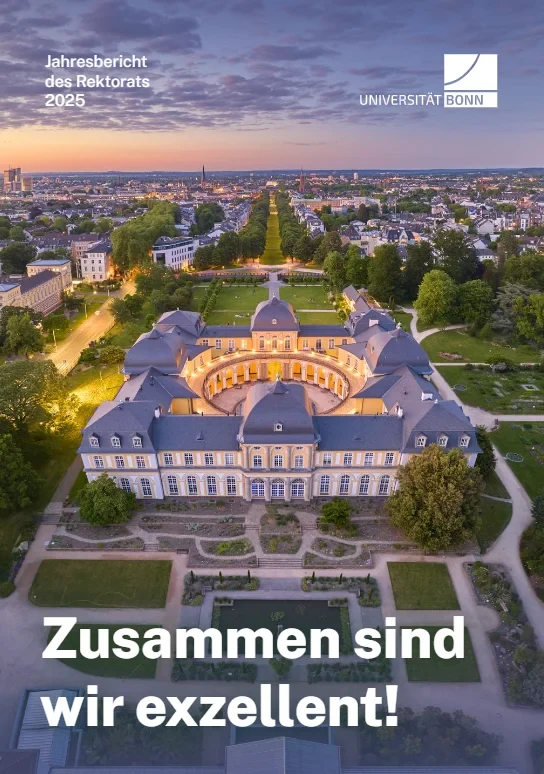 The cover photo of the annual report shows graduates in traditional gowns on the Hofgarten lawn throwing their hats in the air.