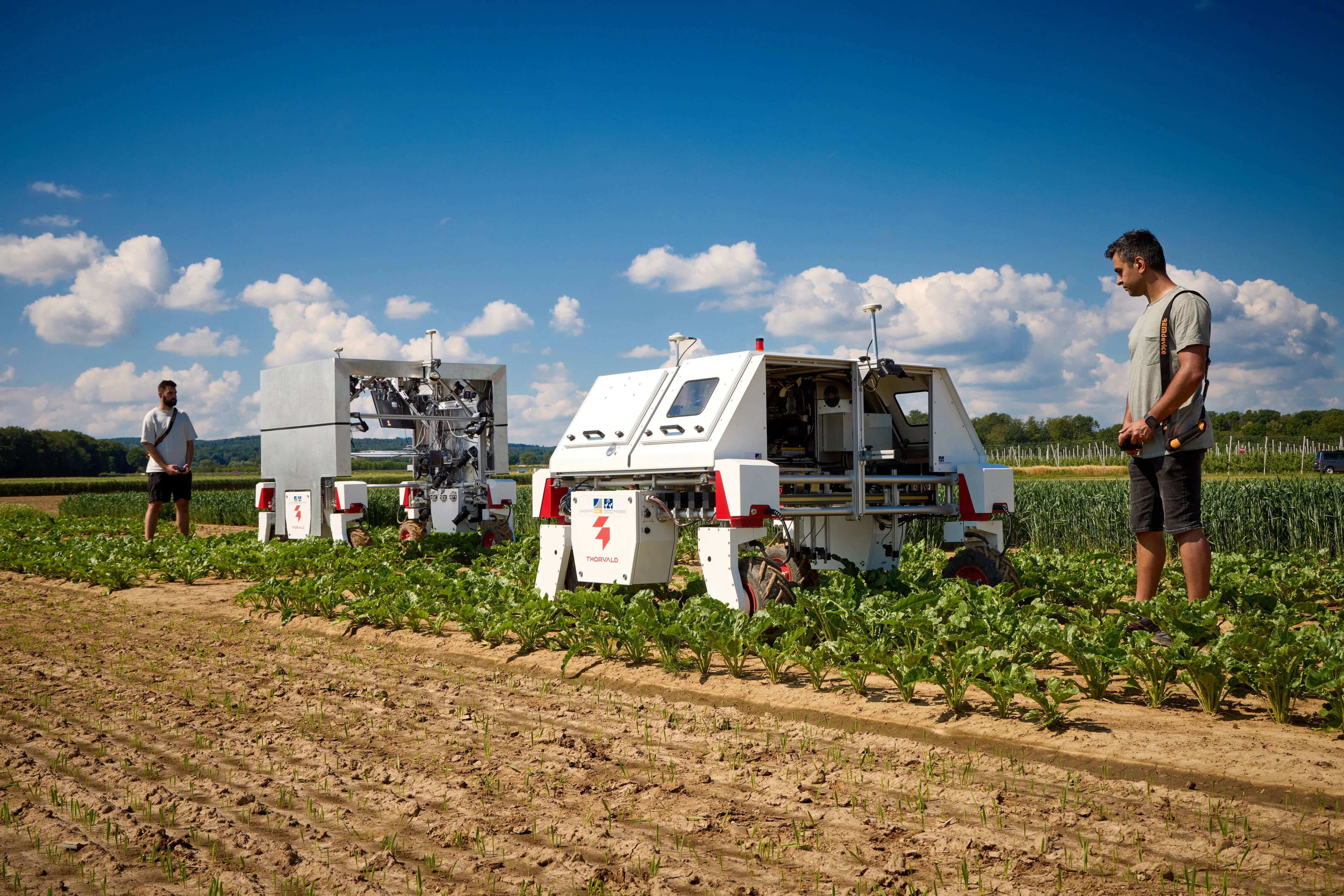 Felix Esser (left) and Alireza Ahmadi (right) testing out the BonnBot’s powers of weed control. 
