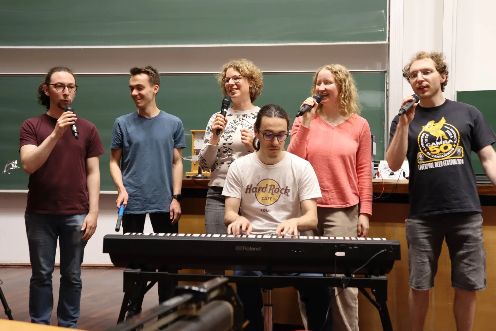 Scenes from rehearsals: When the Phyusical team gets together, they sing.