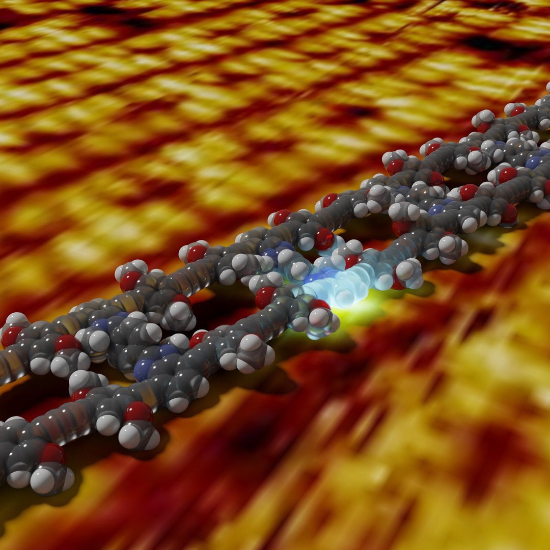 A packet of energy is generated on a molecular ladder by the absorption of light. The background image shows a real measurement of the ladder structure with a scanning tunneling microscope.