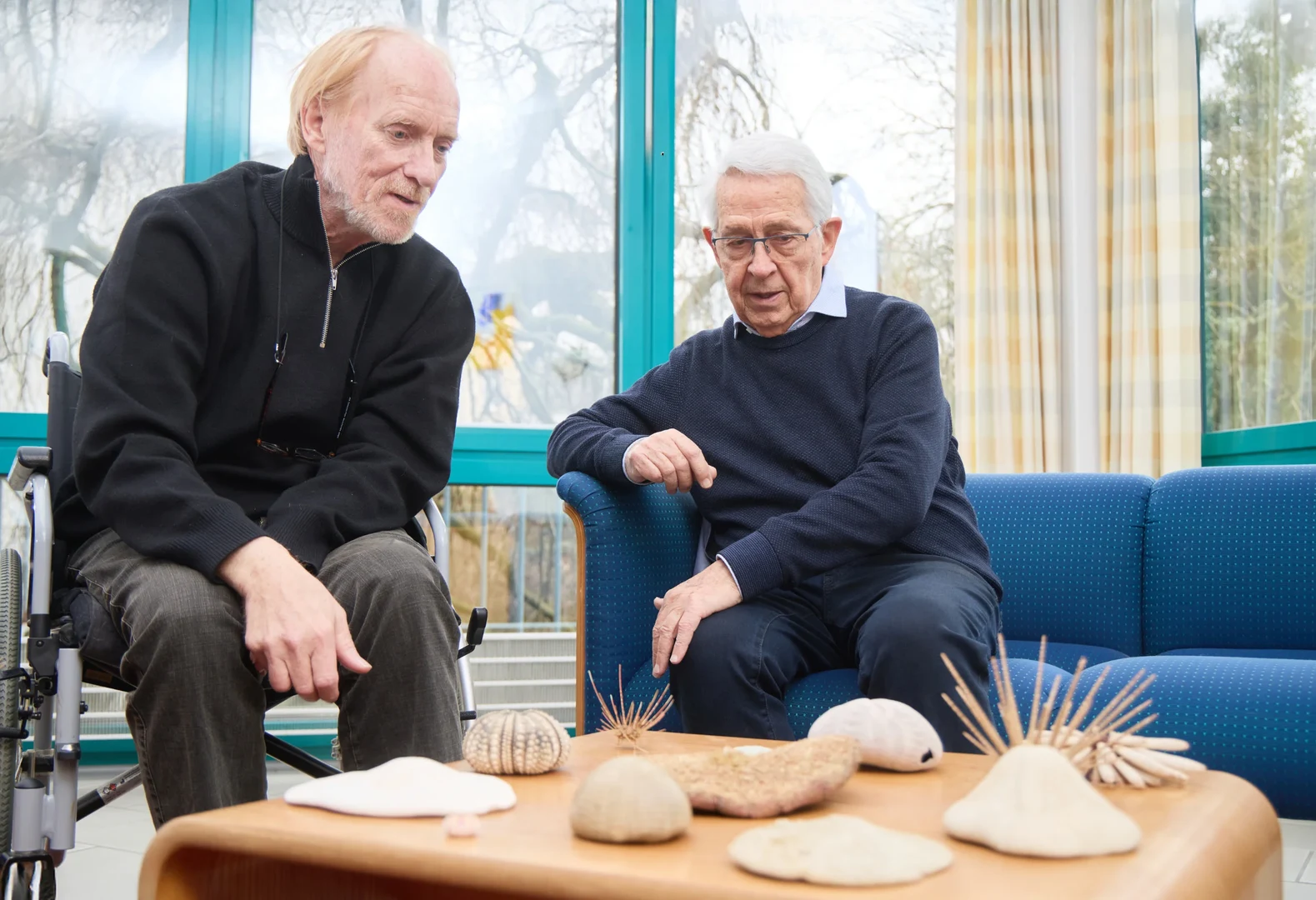 Professor Emeritus Jes Rust (left) and Dr. Hans-Volker Thiel (right) with some of the sea urchin collection.