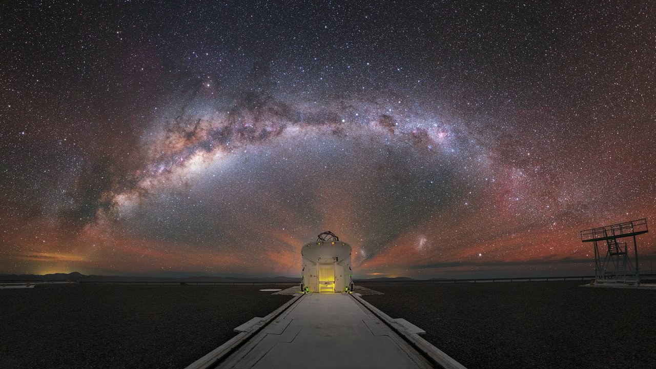 This beautiful image shows the Milky Way stretched out behind one of the Auxiliary Telescopes of ESO's Very Large Telescope (VLT).