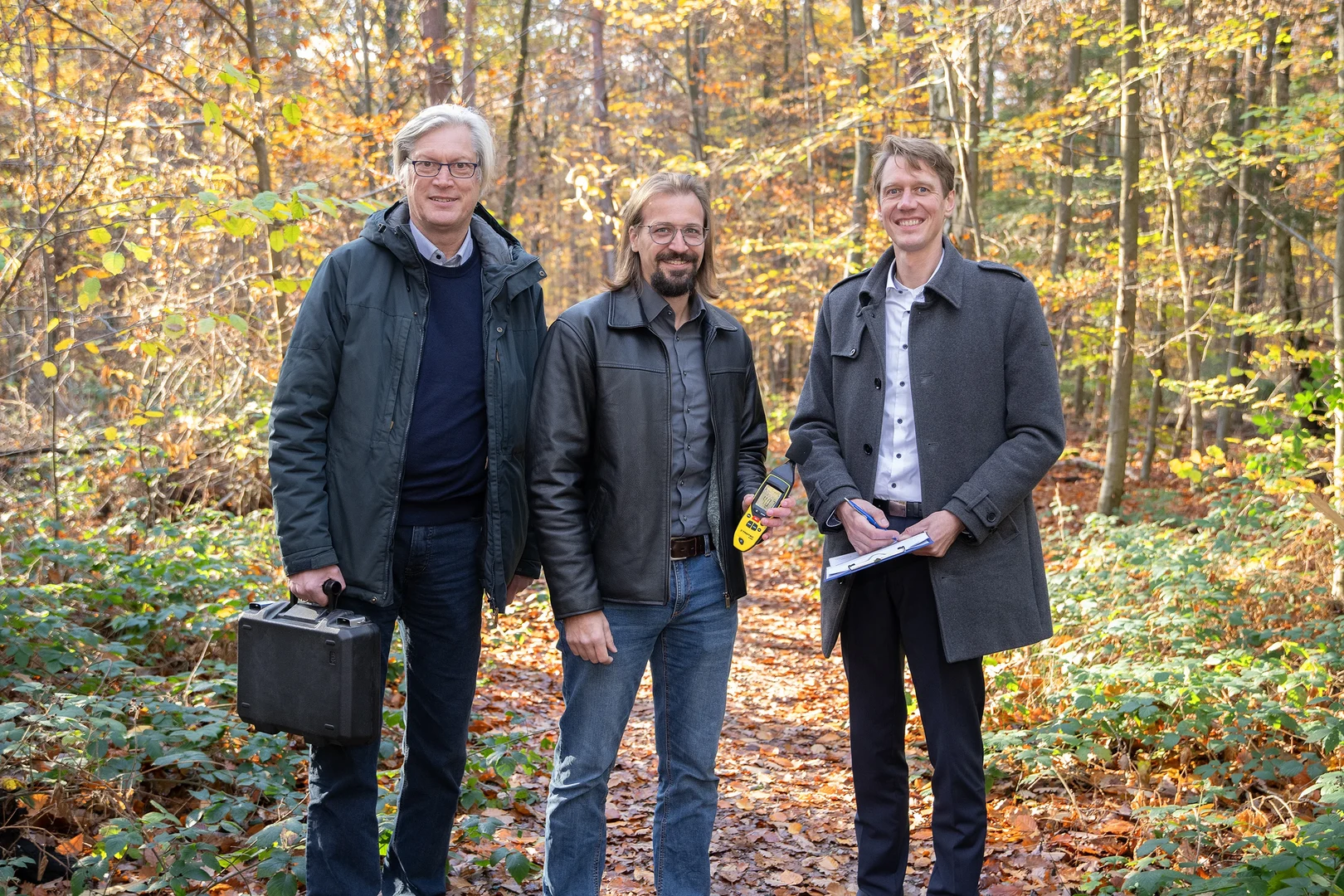 Professor Thomas Kistemann (left), Director of the GeoHealth Centre and the WHO Collaborating Centre (WHO CC) at the University Hospital Bonn, with Dr. Timo Falkenberg (center), head of the IHPH research group, and Professor Nico Mutters (right), Director of the IHPH, conducting measurements in Kottenforst, a popular area for recreation just outside Bonn.