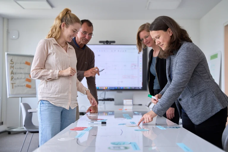 The process management team, from left to right: Process Consultant & Business Analyst Alina Albrecht, Organizational & Process Consultant Rolf Packmohr, Process Manager Tatjana Fuchs and Team Lead Stefanie Freyberger. Photo: Gregor Hübl