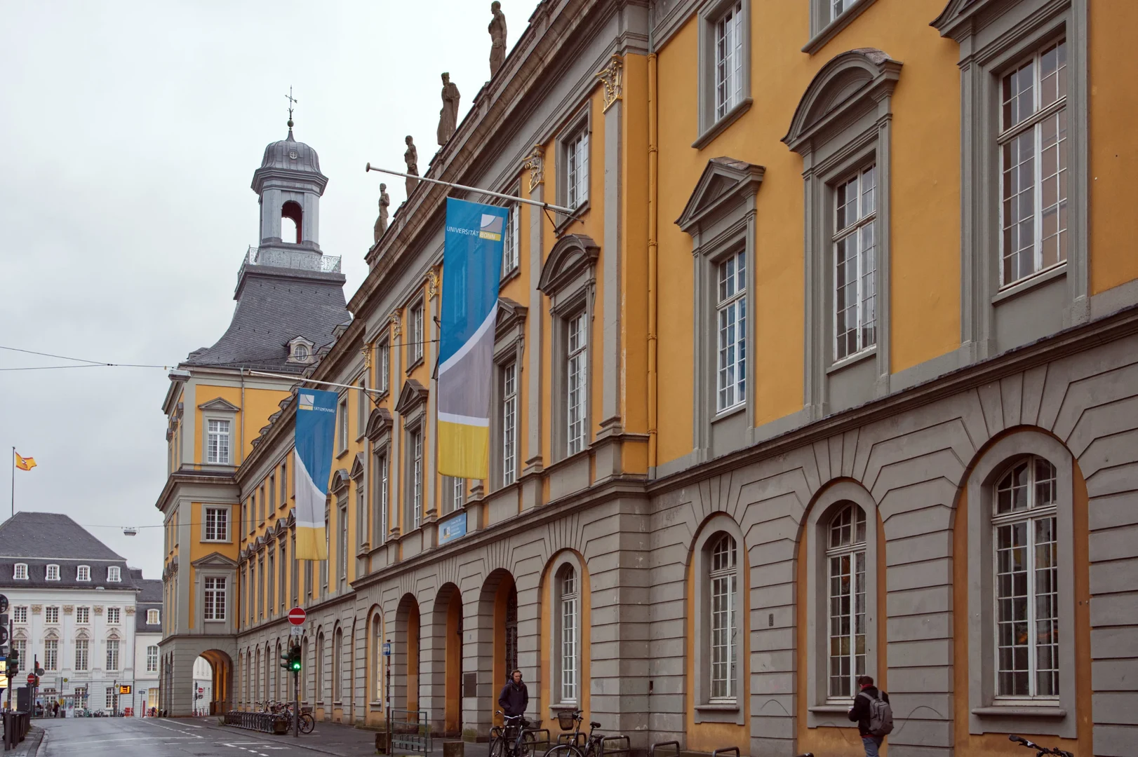Like outside the University of Bonn’s main building, many other universities have today lowered their flags to half-staff to remember the student who was killed and the others who were injured and to mourn in solidarity with Heidelberg University.