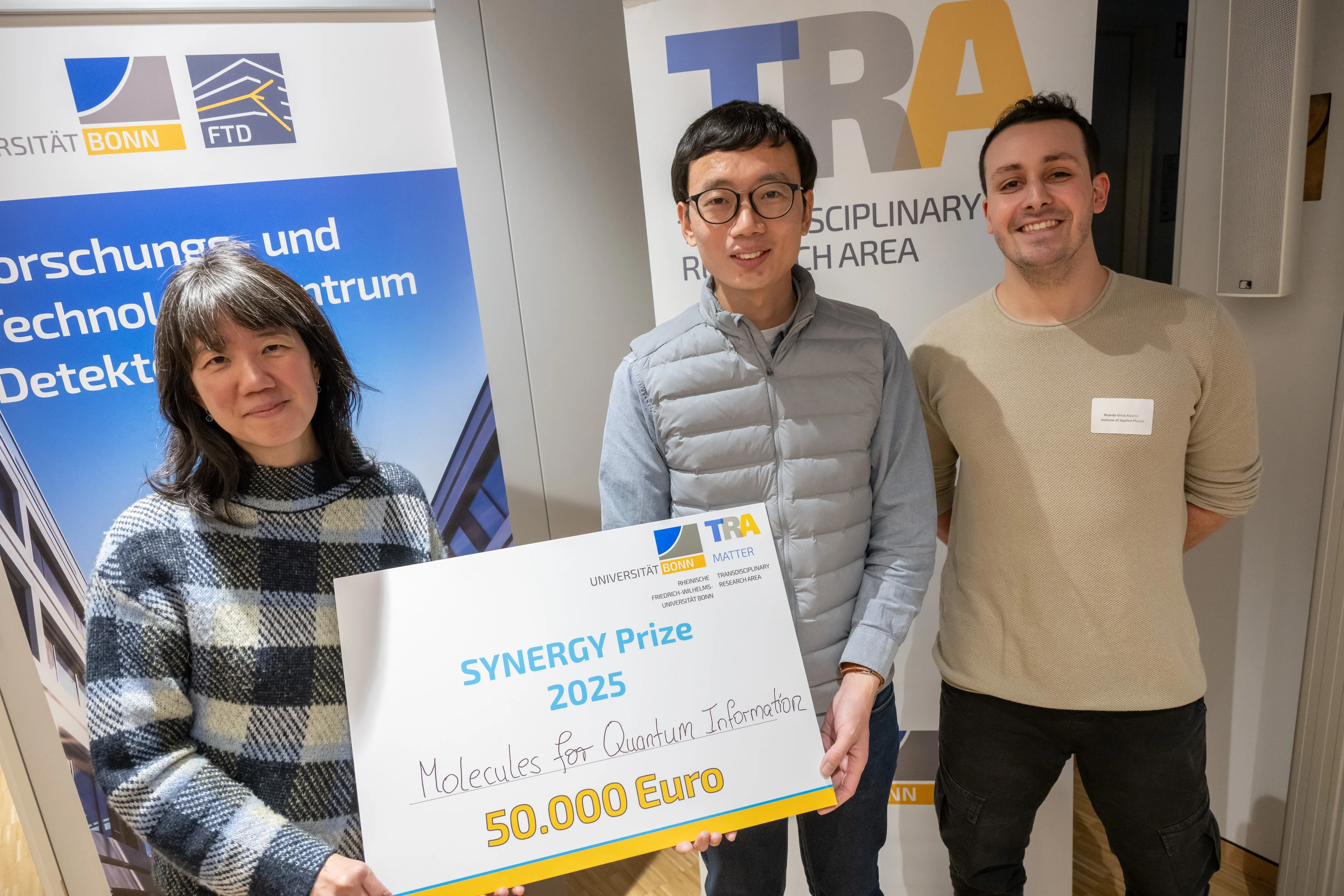 Representing the Synergy Bubble “Molecules for Quantum Information,” the Synergy Prize was accepted by Prof. Connie Lu, Assistant Professor Dr. Daqing Wang, and doctoral student Ricardo Alvarez (from left to right).