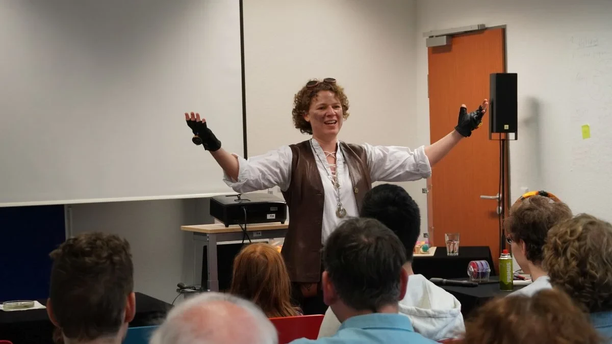 Dr. Jana Heysel performing her science musical show “On Track?”