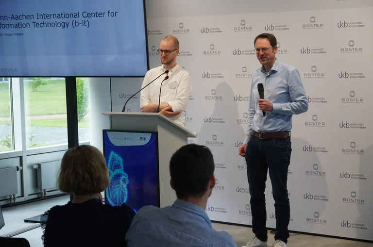 Dr. Jonas Henn (BOSTER) and Prof. Holger Fröhlich (b-it) welcome the participants to #Hack4Surgery
