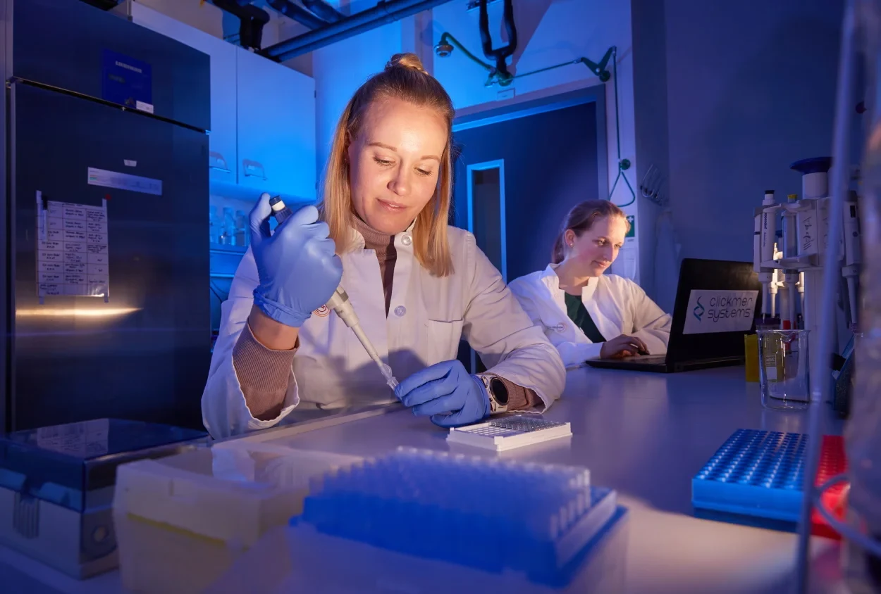 Two female scientists working in a laboratory.